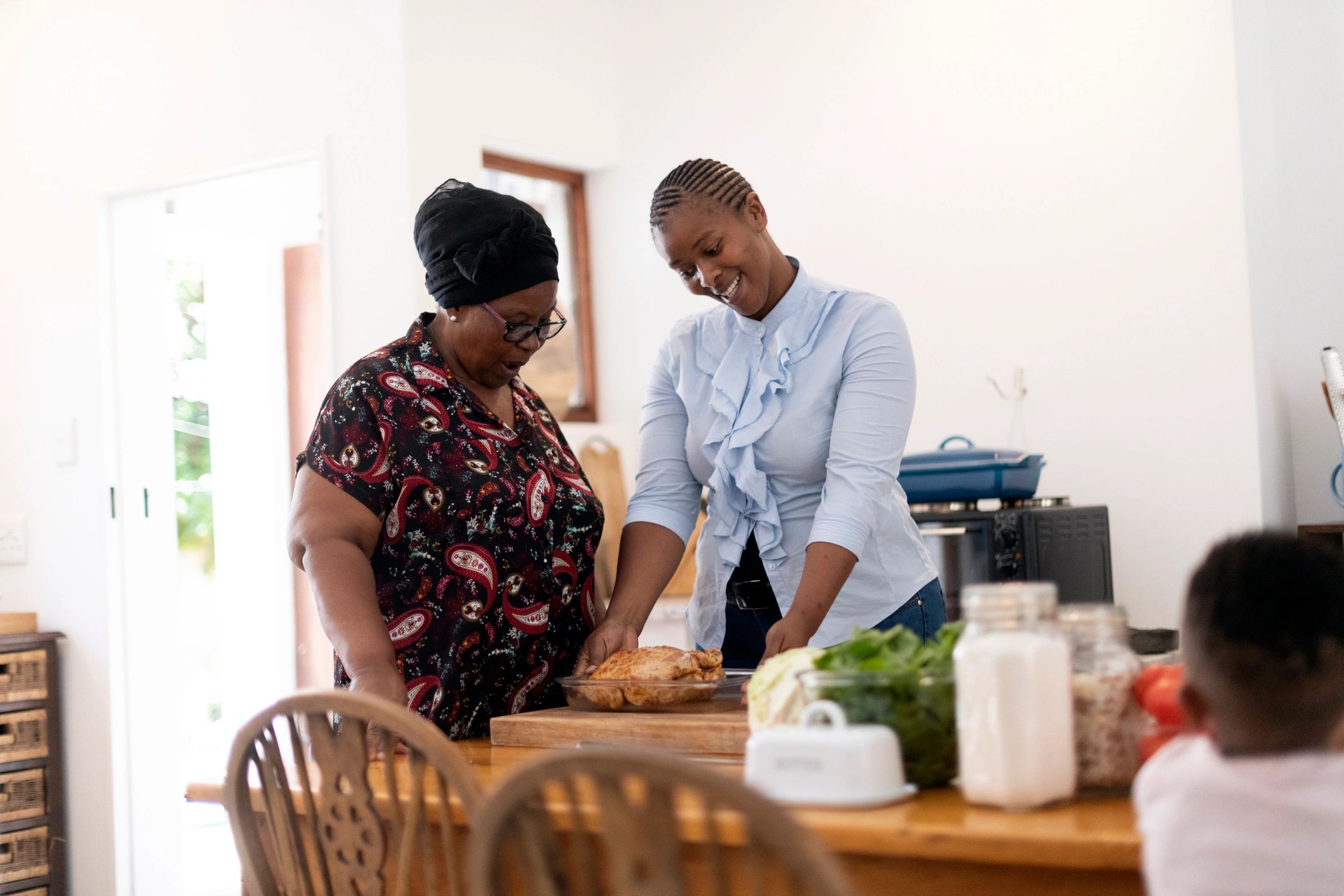 Family members planning together in a kitchen