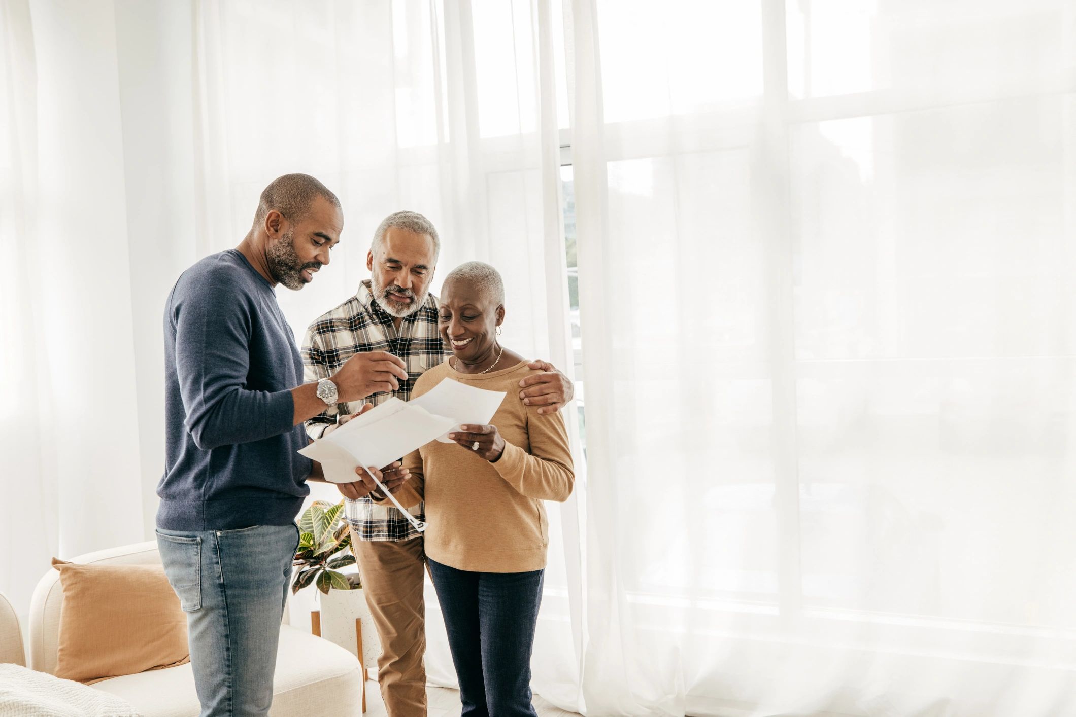 Senior couple meeting at home with a planner