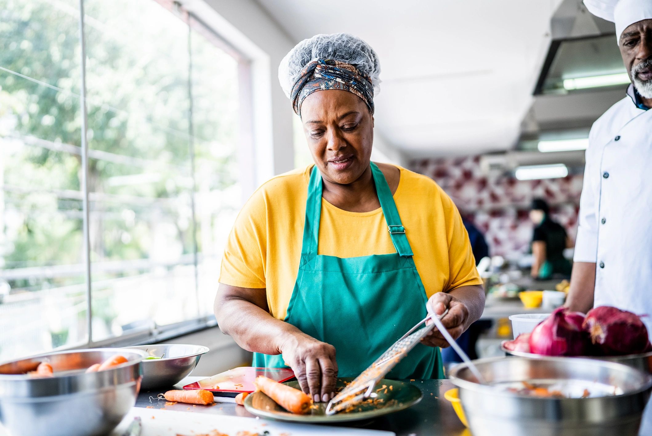 Senior woman cooking in a kitchen