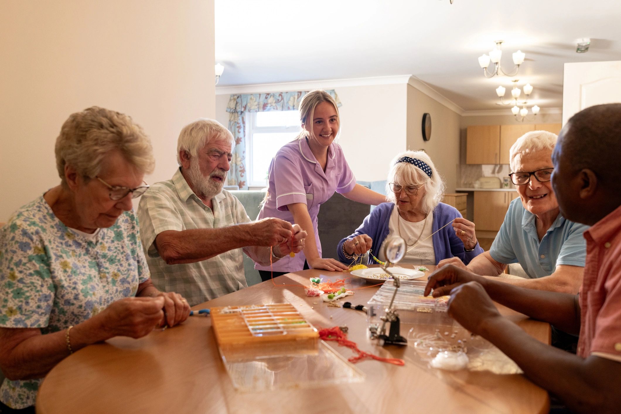 Older adults participating in a community activity with support staff