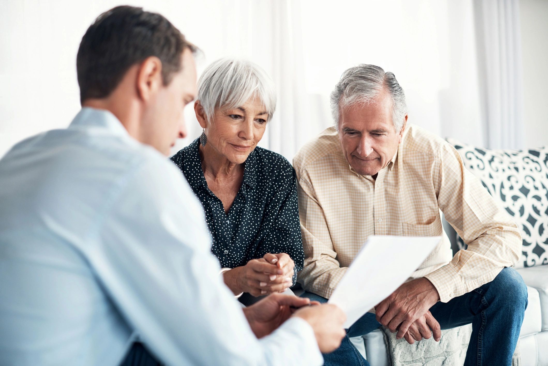 Senior couple reviewing plans at home